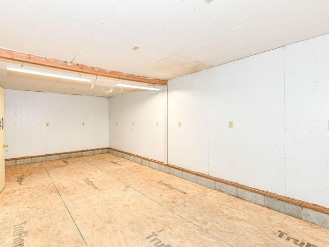 Back room is 12 x 24 with wood floor and finished walls. It was used as a shop with multiple outlets available. | Image 51