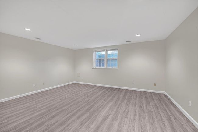 Spare room featuring light wood-style floors and recessed lighting | Image 16