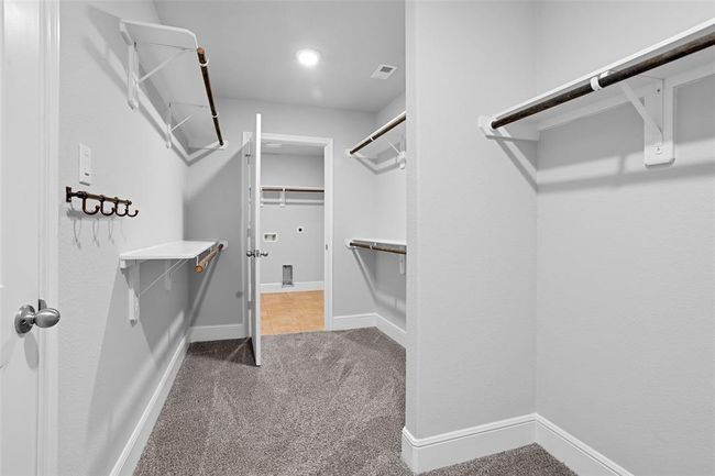 Spacious walk-in master closet with ample storage. | Image 28