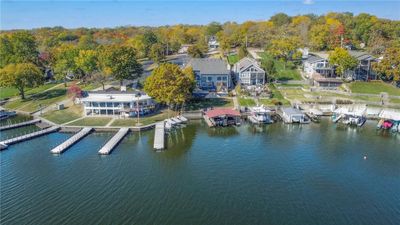 View of patio / terrace featuring a water view and a boat dock | Image 3