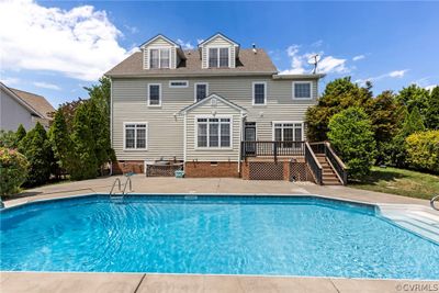 Beautiful landscaping, in-ground pool surrounded by a concrete patio, Trex deck, private back yard, irrigation system, low maintenance vinyl siding, aggregate driveway and a 2 car garage with overhead storage. | Image 2