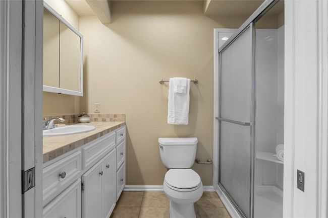Bathroom with vanity and walk-in shower | Image 25