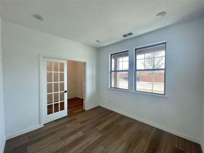 Unfurnished room featuring dark wood finished floors and baseboards | Image 4