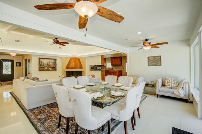 In this photo you have a good idea of how open the family room and formal dining are connected. | Image 10