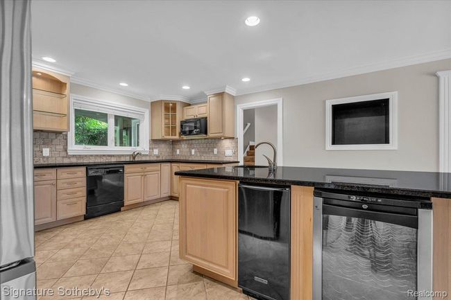 Kitchen with Indoor Grill, Peninsula Island, Granite Counters & Maple Cabinets | Image 13