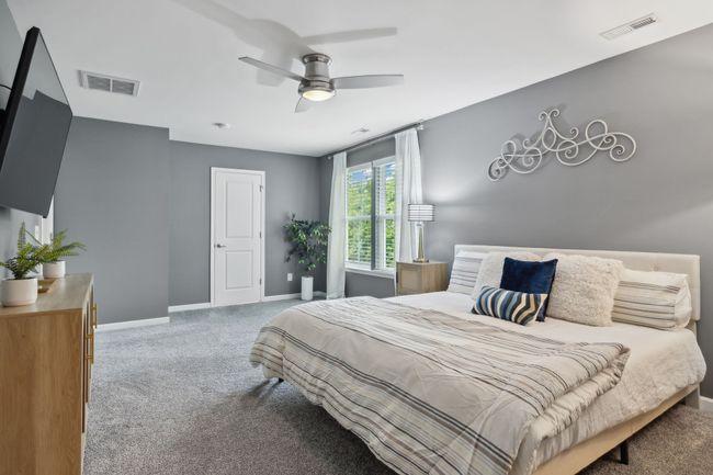 The primary suite is a spacious retreat | Image 18