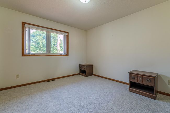 Second of two bedrooms on the main floor. | Image 11