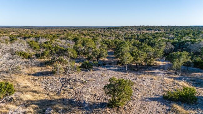 Drone / aerial view featuring a wooded view | Image 26