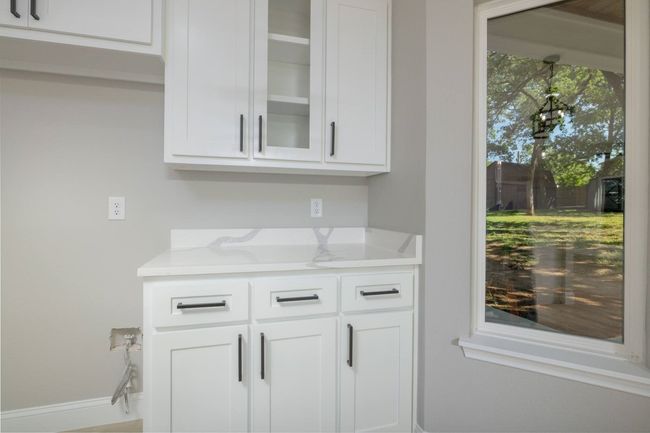 Bar area featuring baseboards | Image 18