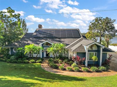 This meticulously landscaped home features solar panels (completely paid for) and a 2024 new roof! | Image 3