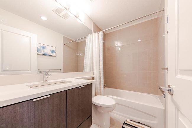 Full bathroom featuring vanity and shower / tub combo | Image 29
