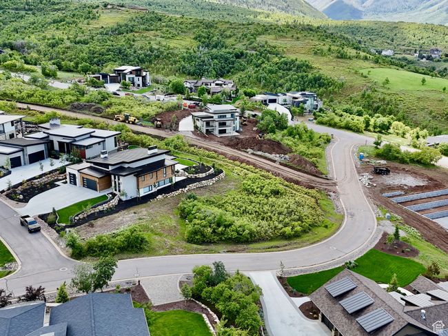 Aerial perspective of suburban area featuring a mountainous background | Image 5