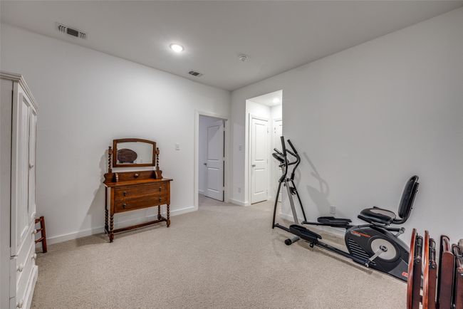Exercise area with recessed lighting, visible vents, light colored carpet, and baseboards | Image 22