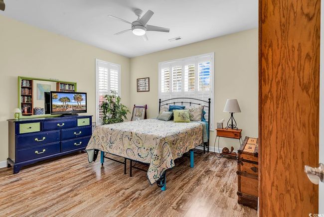 Bedroom with light wood-style flooring, baseboards, a closet, and connected bathroom | Image 26