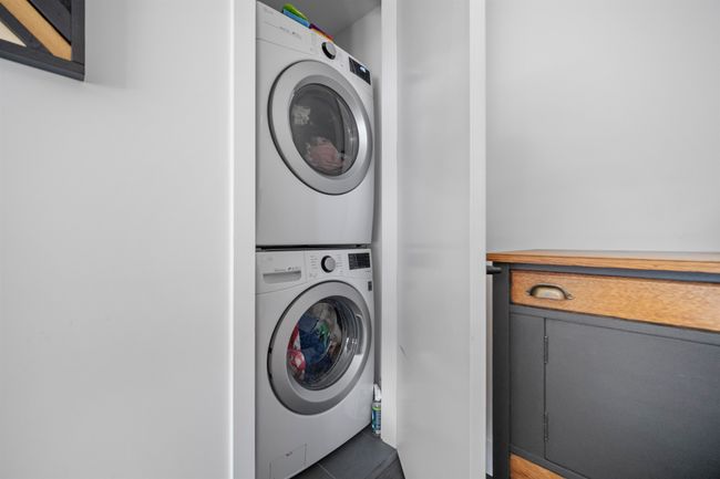 Laundry area featuring stacked washer / dryer | Image 13
