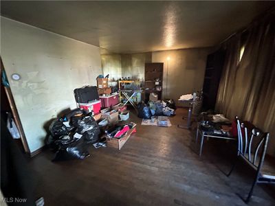 Miscellaneous room with wood-type flooring | Image 3