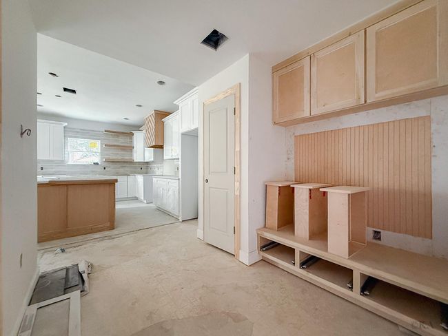 Check out the custom cabinetry in this mud room perfect for dropping off and storing purses/bags, shoes, leashes etc. | Image 9