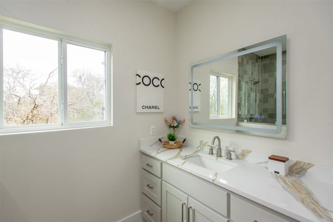 Bathroom featuring vanity and a wealth of natural light | Image 22