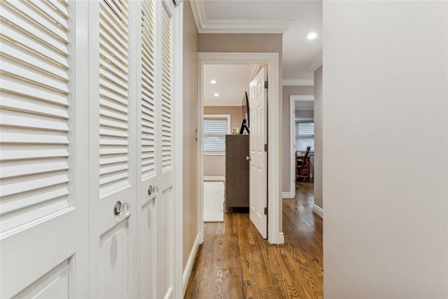 Hall featuring ornamental molding and wood-type flooring | Image 17