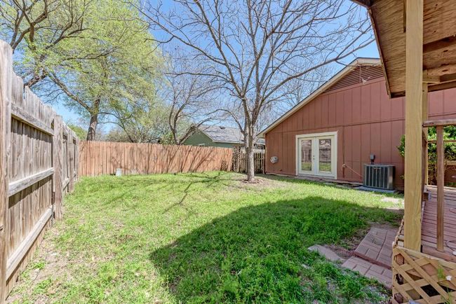 View of yard with cooling unit, french doors, and a fenced backyard | Image 28