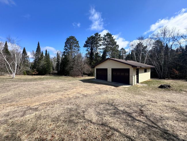 Double detached garage. You will also see here that there is so much space to park your toys, whether that be an RV, camper, ATV's or boats. With this acreage you will find room for everything. | Image 26