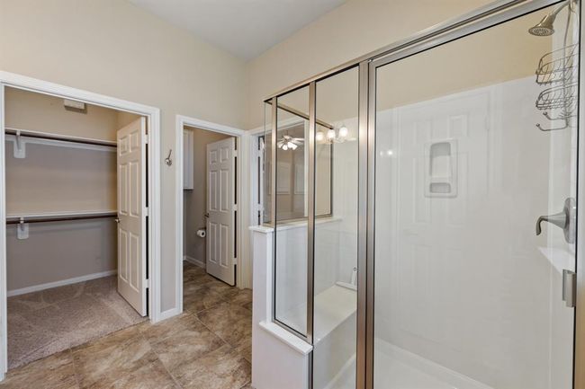 The bathroom also features a spacious walk-in closet for ample storage. | Image 19