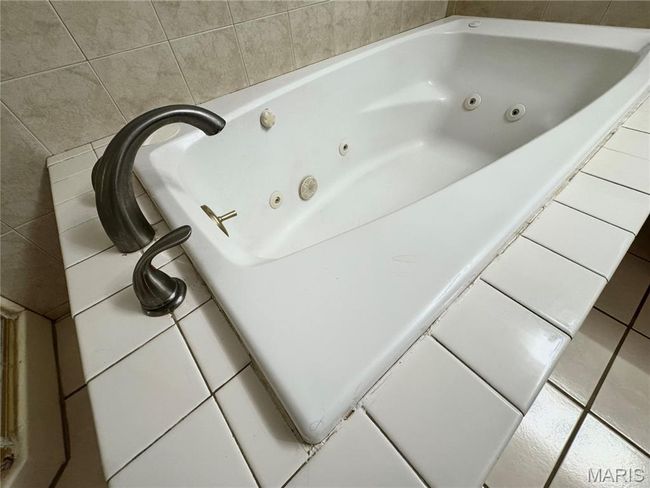 Bathroom featuring a whirlpool tub | Image 18