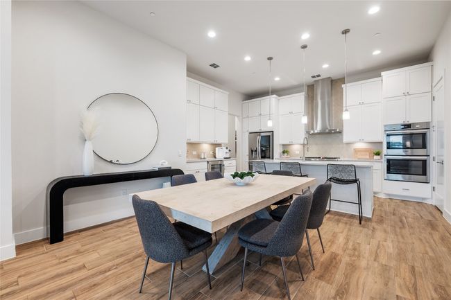 View from dining room to elegant chef's kitchen. | Image 7