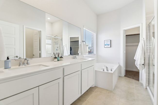 Full bathroom with a sink, tile patterned floors, a spacious closet, and a shower stall | Image 18