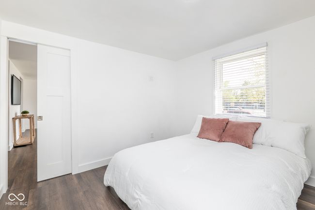 bedroom featuring baseboards and dark wood-style floors | Image 17