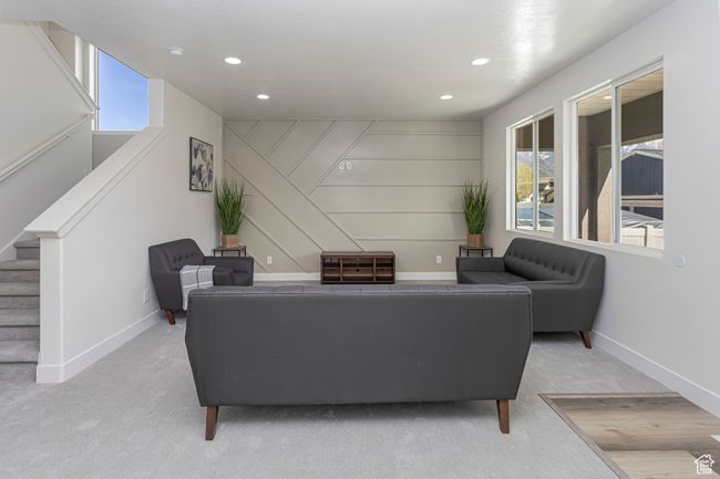Living room featuring baseboards, stairway, carpet flooring, and recessed lighting | Image 9