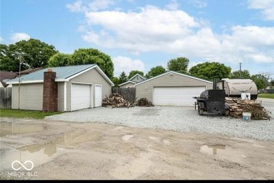 Perfect opportunity for ample garage space with a bonus garage in addition to an oversized 2 car garage. OR convert additional garage into income producing property!! | Image 1