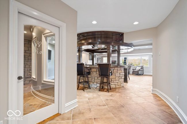 Adjacent to the bar is the spacious wine room. | Image 26