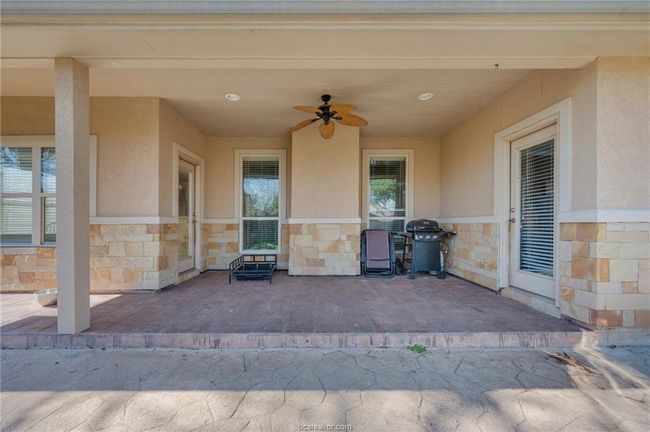 View of patio / terrace with a grill and a ceiling fan | Image 26