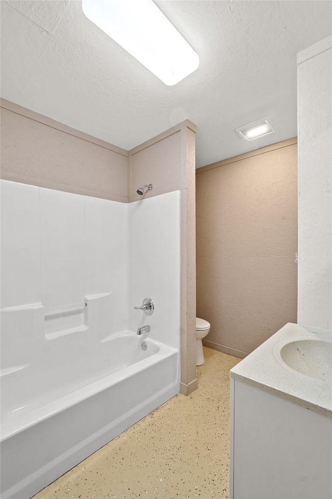 Full bathroom featuring shower combination and vanity | Image 33