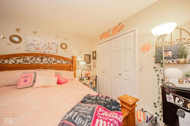 bedroom featuring a closet | Image 26