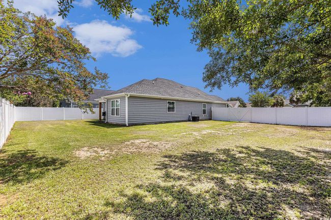 Rear view of property with a fenced backyard | Image 32