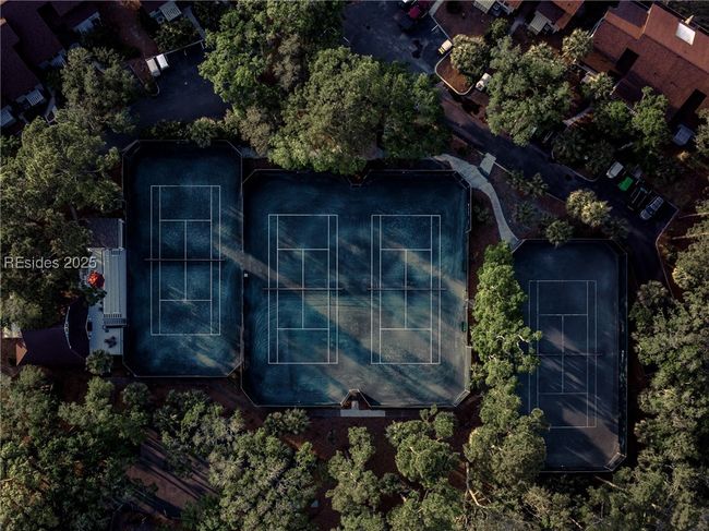 Fripp Island's Racquet Club offers a premier tennis experience with eight Fast-Dry clay courts and two hard surface courts, complemented by six permanent pickleball courts, providing year-round play and a variety of programs for all ages and skill levels. | Image 80