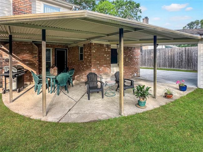 This property boasts multiple entertainment spaces, both indoors and out, perfect for creating unforgettable moments. | Image 28