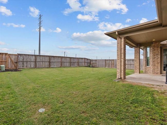 Nice size back yard with a covered patio and no back neighbors | Image 39