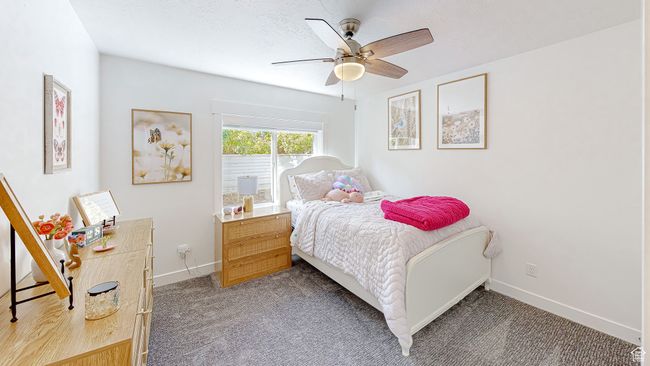 Bedroom with baseboards, carpet floors, and a ceiling fan | Image 40
