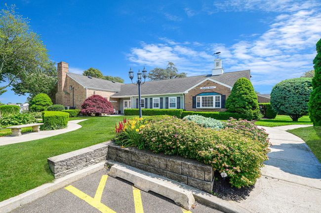 View of front facade with brick siding, a front lawn, and a chimney | Image 25