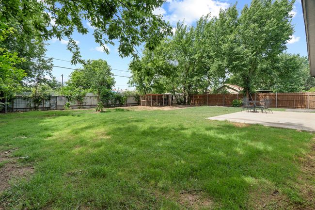 Fenced backyard featuring a patio area | Image 35