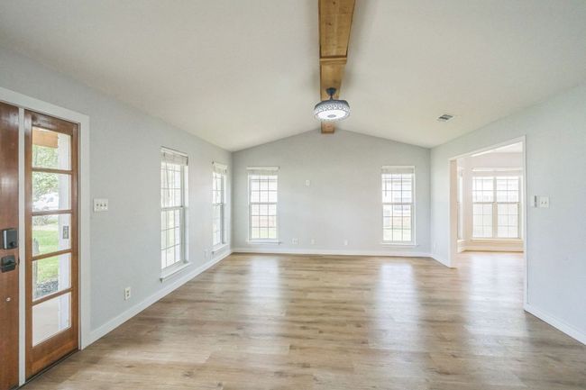 Living room featuring healthy amount of natural light and light wood-style flooring | Image 5