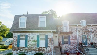 View of front of property featuring a balcony and central AC | Image 2