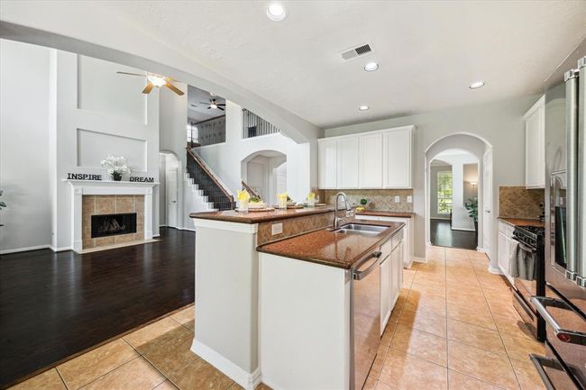 42" cabinets, granite counter tops and the island kitchen are valuable upgrades. | Image 25