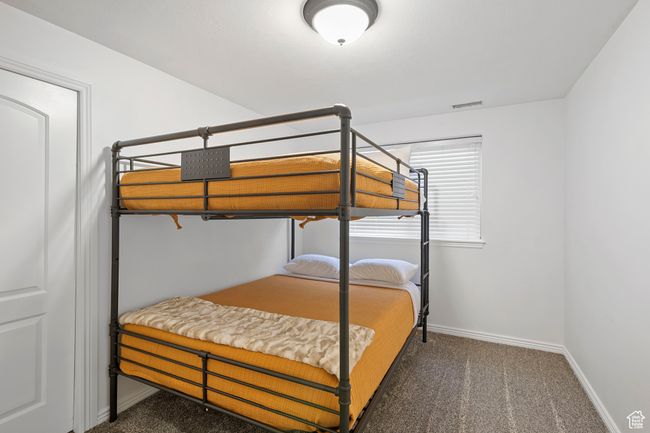 Bedroom featuring dark carpet | Image 26
