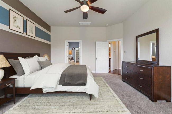 This photo of the primary bedroom has been virtually staged. | Image 21