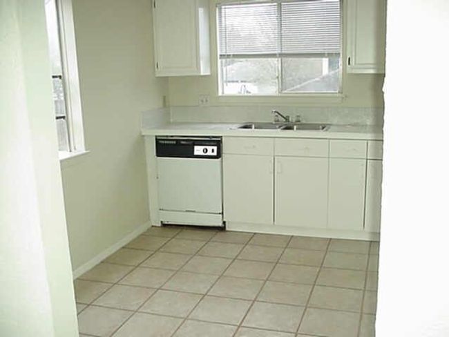 Italian porcelain tile adorns the kitchen floor and commercial grade Italian tile is on the countertops too. | Image 6