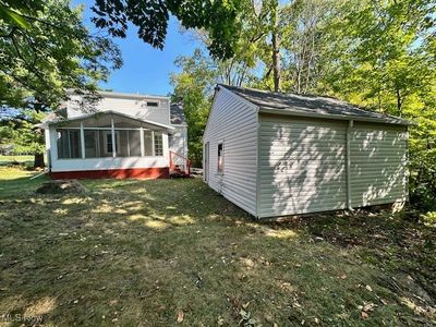 Rear view of house featuring a yard and a sunroom | Image 3